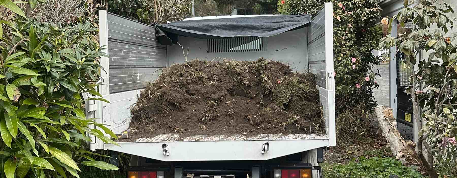 Tipper full of mulch and soil