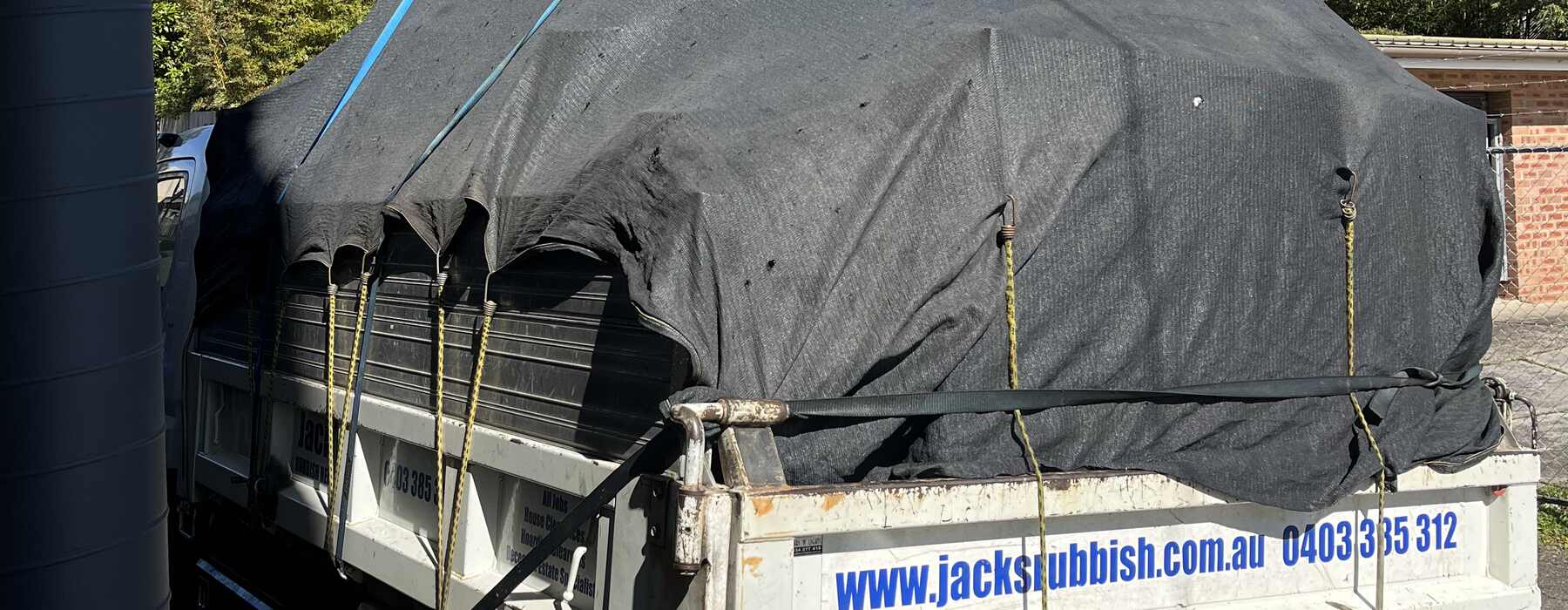 Tarped load under a carport