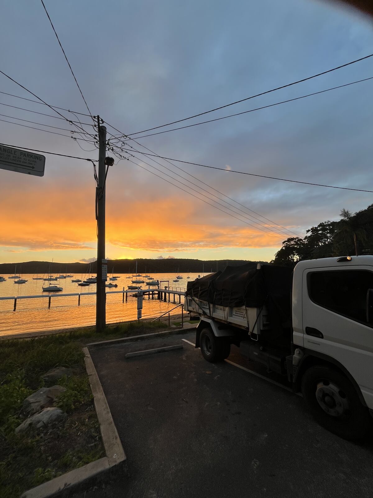 A Jack's Rubbish truck at the end of a long day on the water's edge