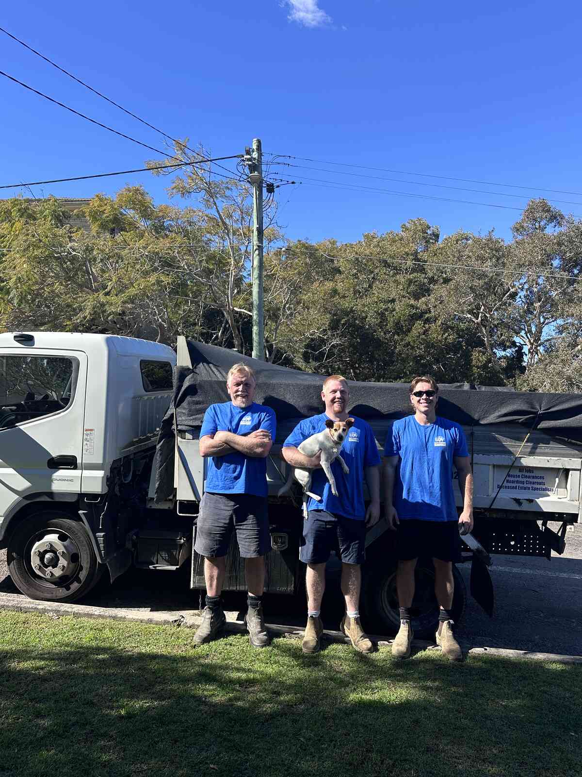 The Jack's Rubbish crew beside the branded truck