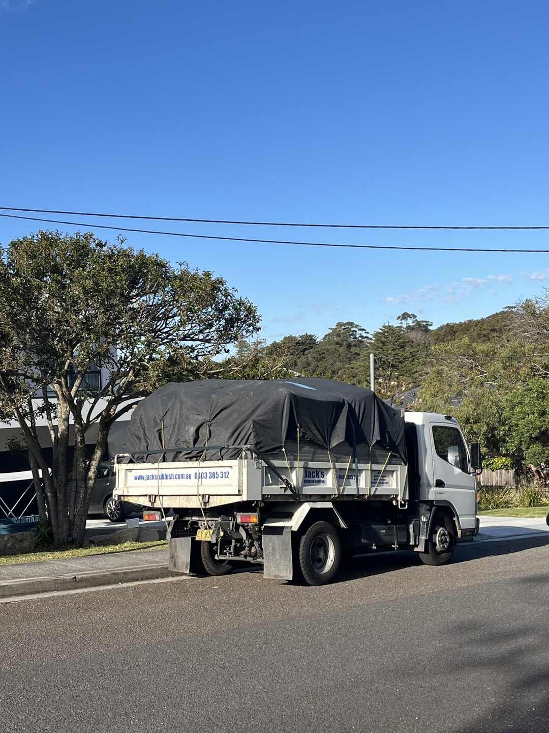 A branded Jack's Rubbish truck ready for a Mosman estate clearance