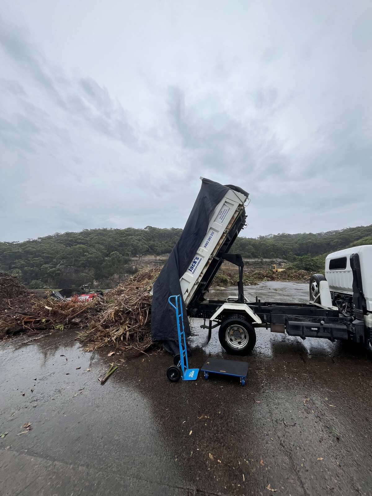 A Jack's tipper unloading a truckload of green waste and garden clippings